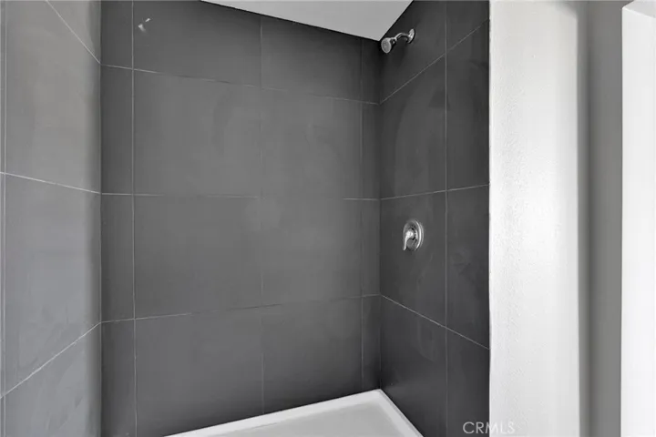 Completely remodeled from top to bottom featuring brand-new flooring, upgraded windows, fresh paint, stylish countertops, and beautifully updated cabinetry throughout.
