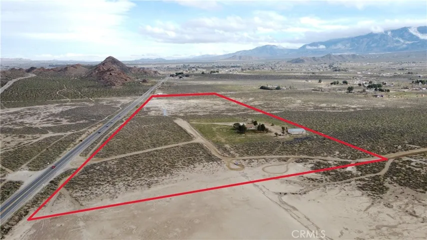 28.64 acres - 2,280 sq ft home - 2,400 sq ft airplane hangar/shop - Private well  - Hwy 18 frontage - Western Lucerne Valley