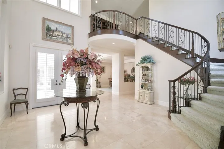Grand entrance to the home with spiral staircase!