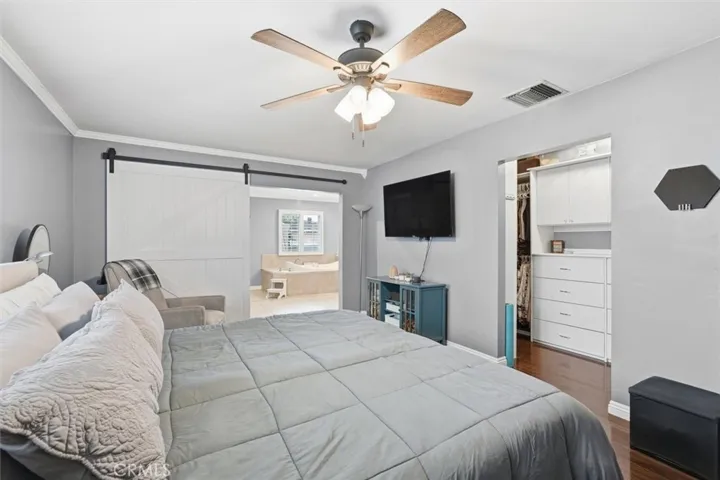 Primary Bedroom looking into en-suite bathroom and walk-in closets