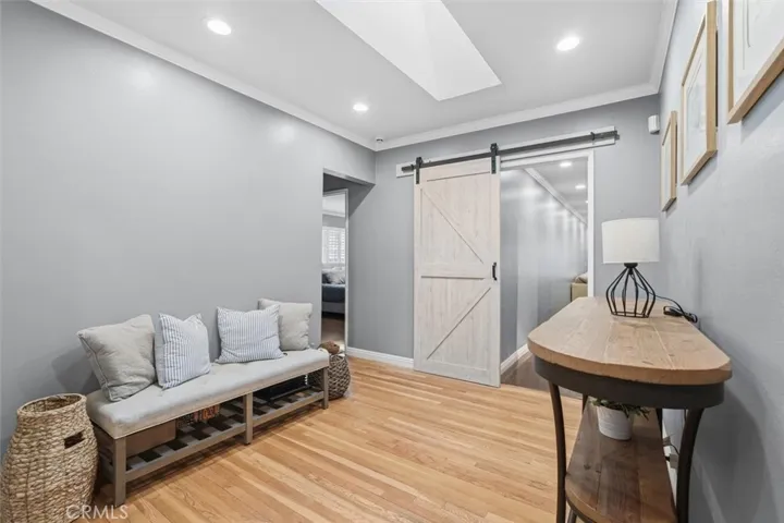 Sitting room leading to Primary Bedroom to the left and Family Room to the back