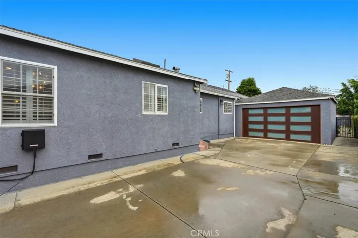Long Driveway with newer garage door for 2 car garage