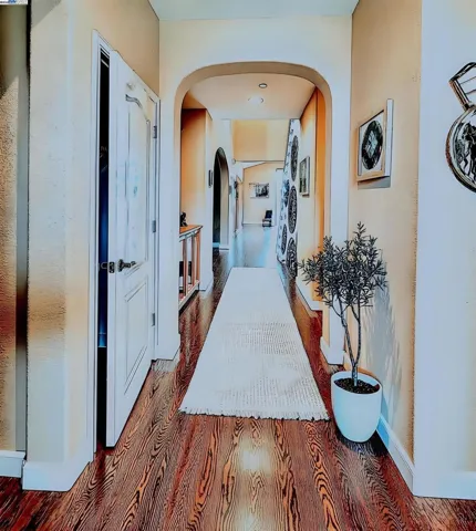 Hallway after entering the property is virtually staged.