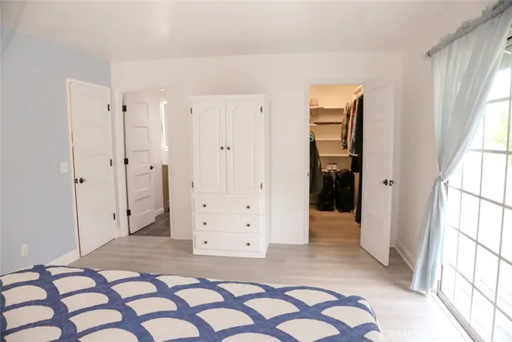 Primary bedroom with walk-in closet and ensuite bathroom