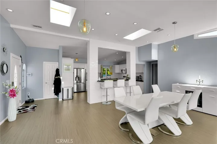 View from living area toward dining, entry and kitchen