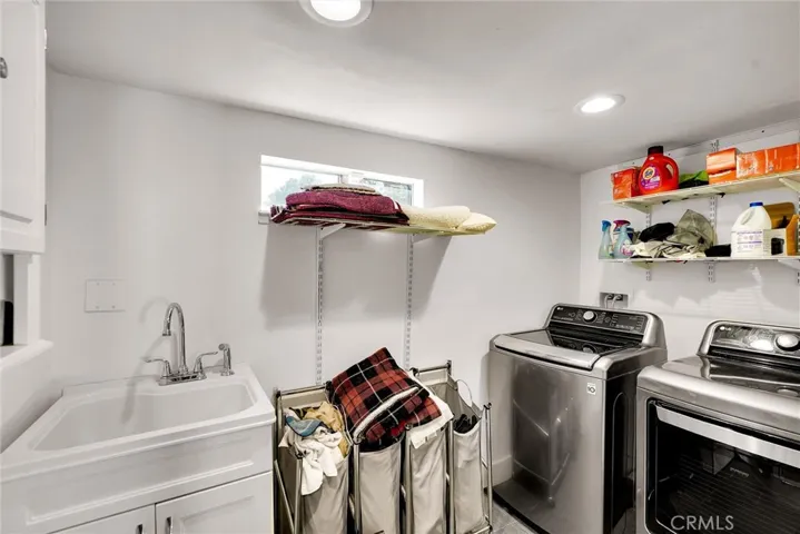 Laundry room off of hallway to garage. Washer and dryer are included