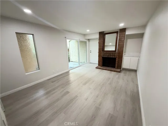 Den with Main Floor Slider Entry and Fireplace

