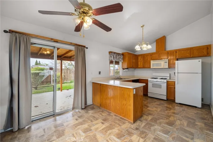 un-staged kitchen and dining area.