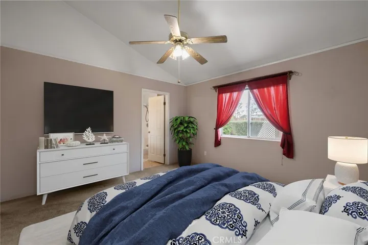 Digitally staged primary bdrm photo