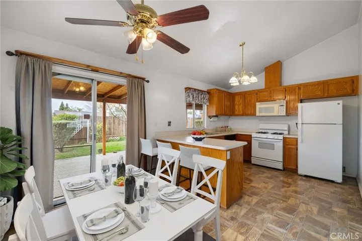 Digitally staged kitchen and dining area