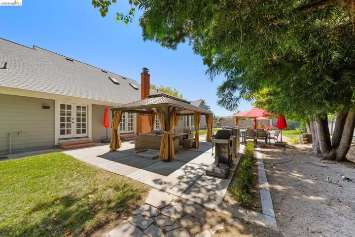 View of patio / terrace featuring an outdoor living space, a gazebo, french doors, and area for grilling