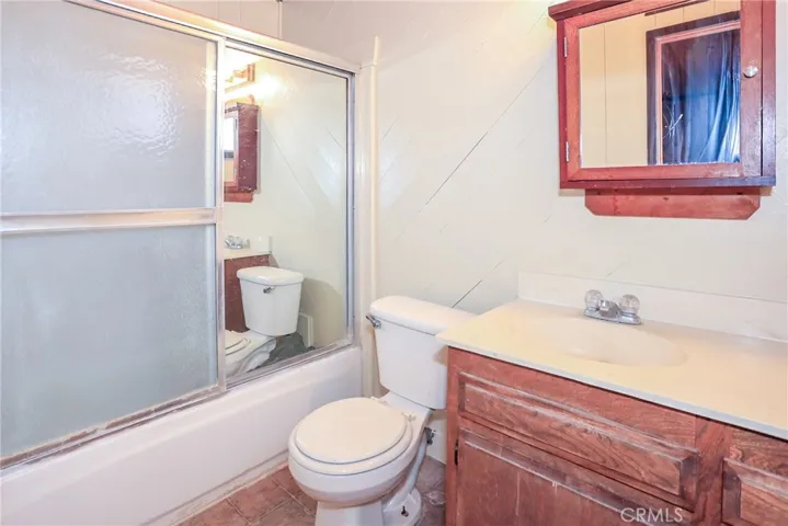 primary bedroom with full bath