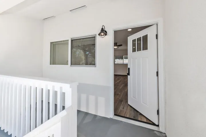 FRONT ENTRANCE WITH BALCONY PATIO