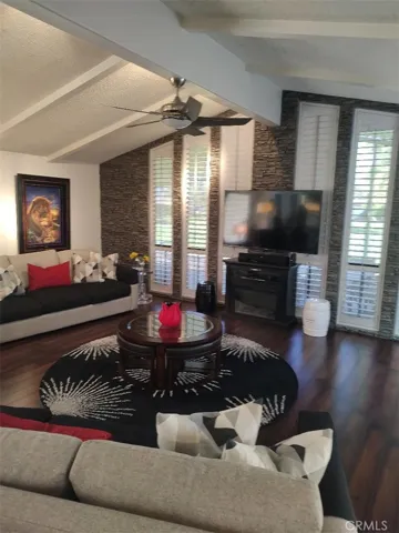 FAMILY ROOM WITH FIRE PLACE AND VAULTED CEILINGS