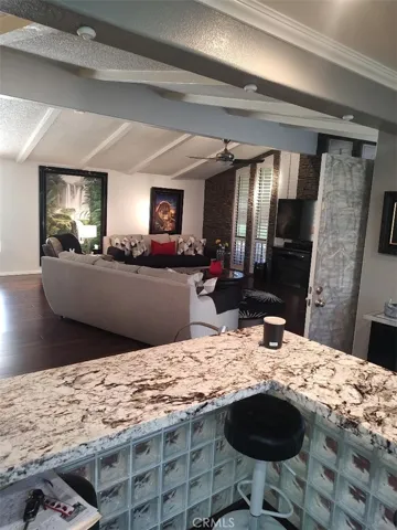 BREAKFAST BAR OVER LOOKING FAMILY ROOM FROM KITCHEN