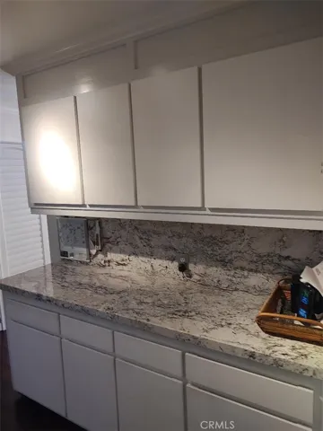 LINENS AREA WITH GRANITE COUNTER TOP