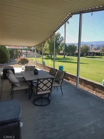 OUTSIDE LARGE COVERED PATIO ON GOLF COURSE