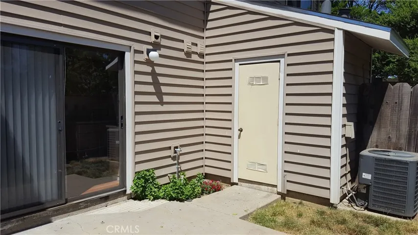 Backyard Patio and Water Heater Closet.