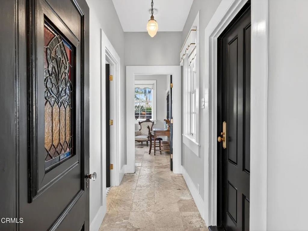 Hallway to downtairs primary suite