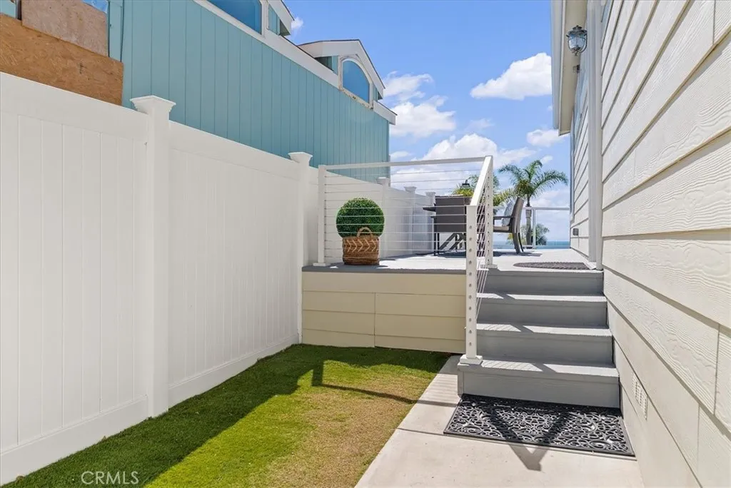 A Gated Entry Courtyard Lawn; Neighbor's $350,000 remodel is now complete. Come "sea"!