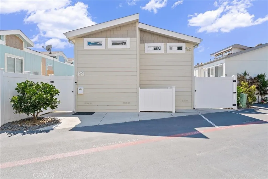 Home has both side yards and back deck all fully-fenced. Plus, bearing orange tree in front.