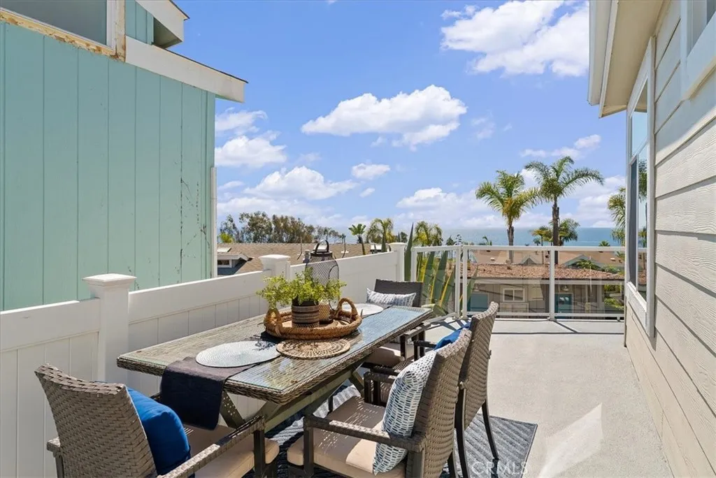 A Blue Ocean Backdrop for Outdoor Dining Patio (Neighbor's Home just completed a $350,000 remodel)