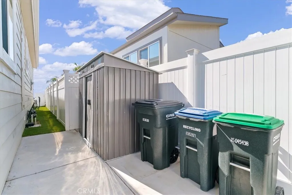 Gated Parking Area & Dog Run has Surfboard Racks, Storage Shed & Trash