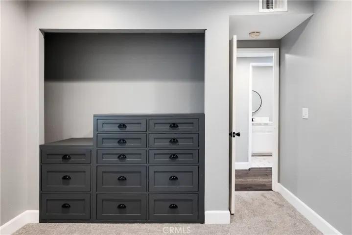 3rd bedroom with built in drawers in closet