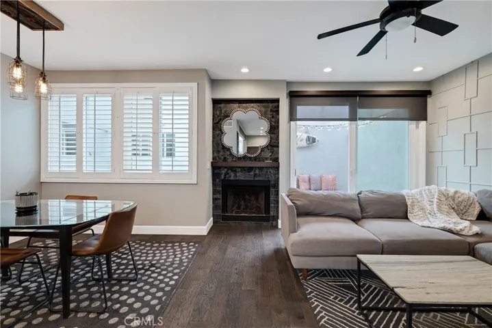 dining room and living room with gas fireplace