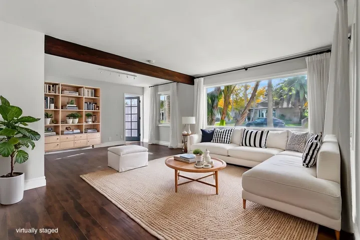 Huge living room at front of house, with tons of natural light (south-facing).  Virtually staged.  Unstaged photo below, or here:  https://bit.ly/940Dogwood