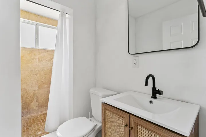 Downstairs full bathroom with shower.