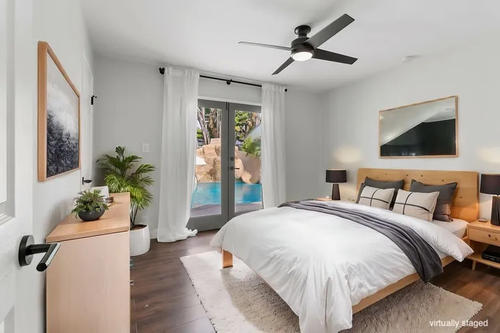 Bedroom #3 downstairs with French doors to back yard. Virtually staged.  Unstaged photo below, or here:  https://bit.ly/940Dogwood