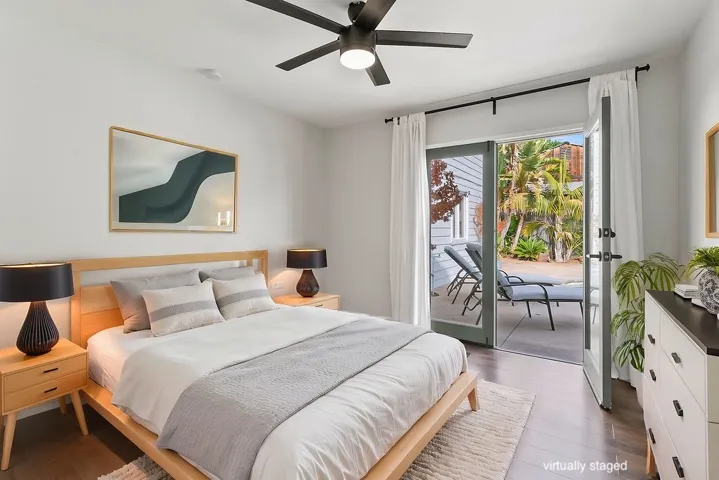 Bedroom #2 downstairs with French doors to back yard. Virtually staged.  Unstaged photo below, or here:  https://bit.ly/940Dogwood