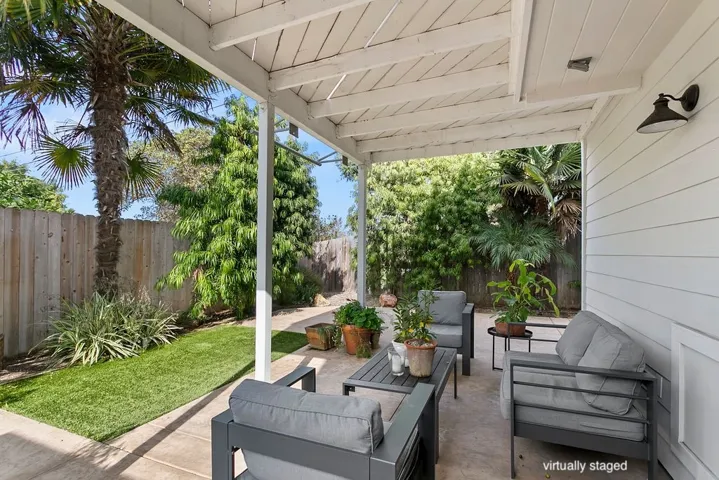 Patio outside kitchen at rear of home.   Virtually staged.  Unstaged photo below, or here:  https://bit.ly/940Dogwood