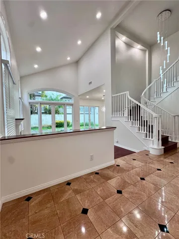 Entrance to home with cathedral ceilings