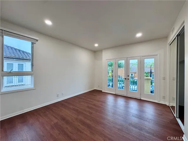 2nd bedroom with french doors to balcony area