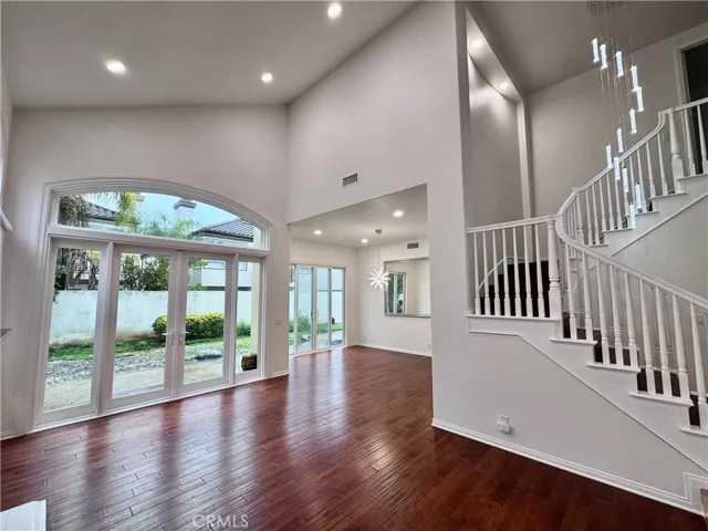 Formal living room with cathedral ceilings