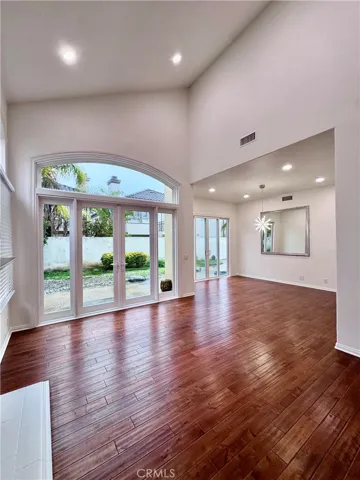 Formal living room with french doors to backyard