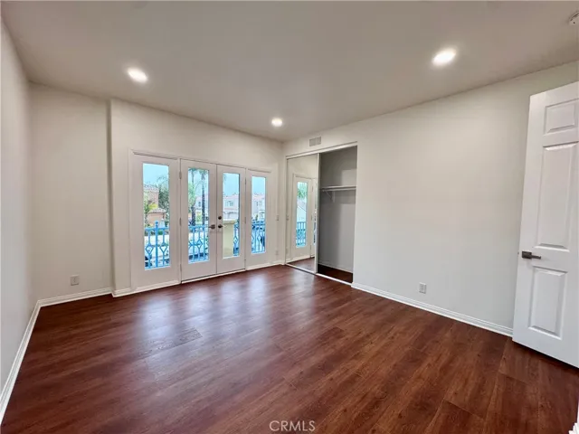 2nd bedroom with french doors to balcony area