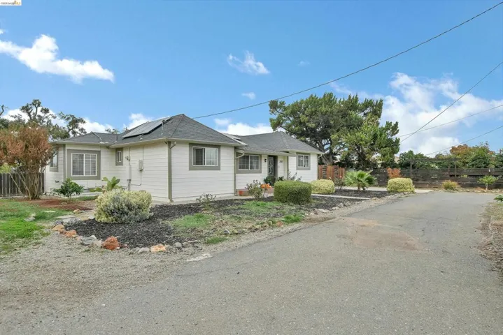 View of front of home with solar panels