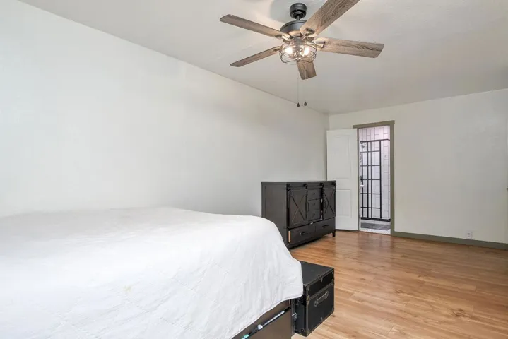 Bedroom featuring light wood-style floors and a ceiling fan