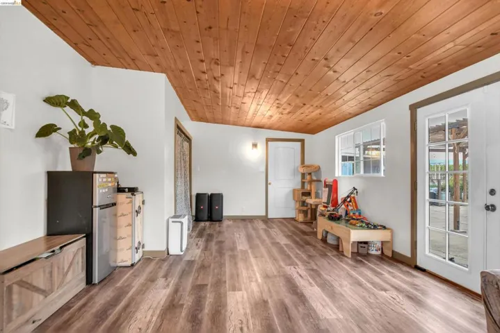 Rec room with wood ceiling and wood finished floors