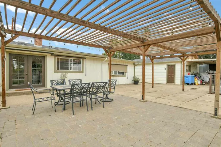 View of patio / terrace featuring a pergola and outdoor dining area