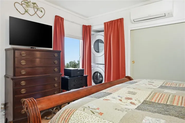 Master Bedroom with new Washer and Dryer and view to Clearlake