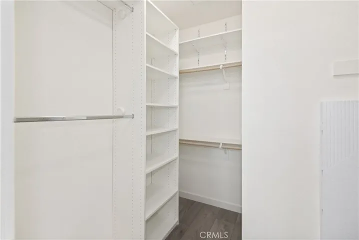 Walk in closet in primary bedroom