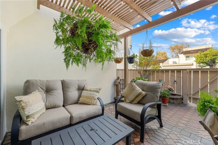 Cozy patio area updated with pavers and planter in 2020