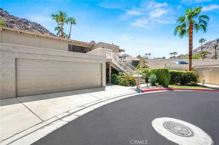 Front of unit with 1 garage space