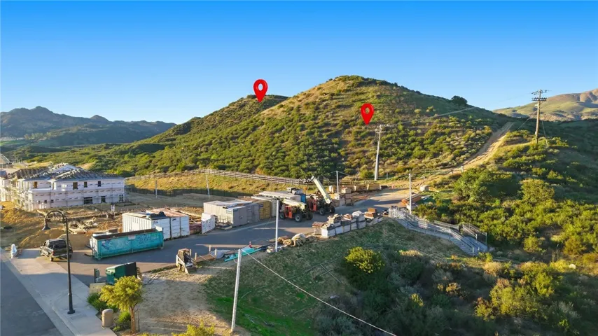 Photo shows the intersection of Deer Lake Ranch Rd and Horseshoe Trail.  Horseshoe Trail is the small street that runs from Deer Lake Ranch Rd to the bottom of the hill and currently has some construction storage containers.