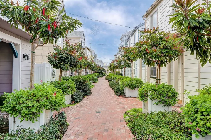 Beautifully landscaped brick walkway leading to the entry of Unit 29
