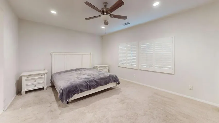 AI clutter removed primary bedroom